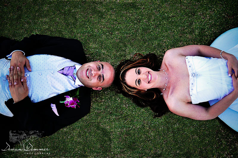 Newly Wed couple, lie on the grass