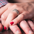 Bride and grooms hands and ring Colour Dusty