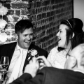 bride and groom share a laugh