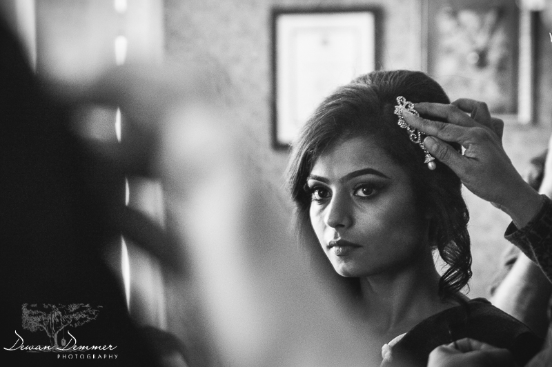 attaching hairpiece in brides hair